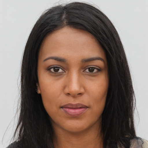 Neutral black young-adult female with long  brown hair and brown eyes