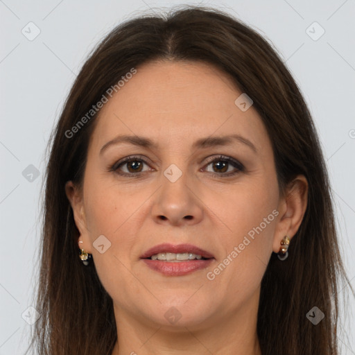 Joyful white adult female with long  brown hair and brown eyes