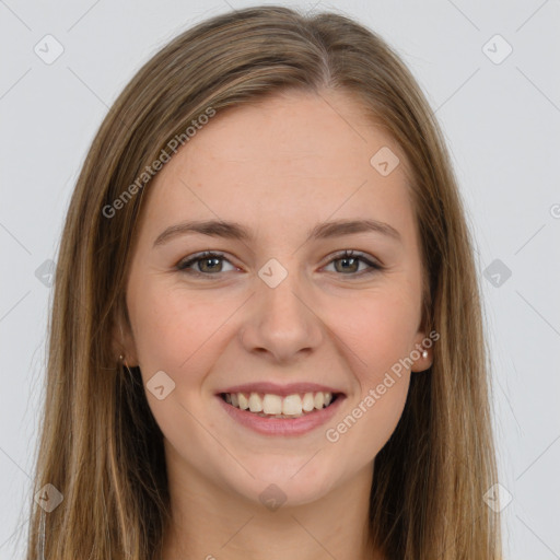 Joyful white young-adult female with long  brown hair and grey eyes