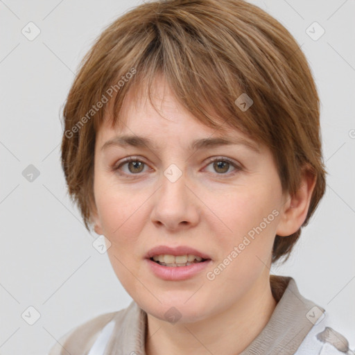 Joyful white young-adult female with medium  brown hair and grey eyes