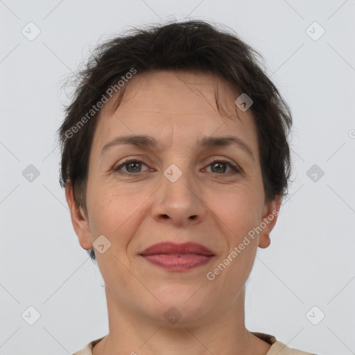 Joyful white adult female with short  brown hair and brown eyes