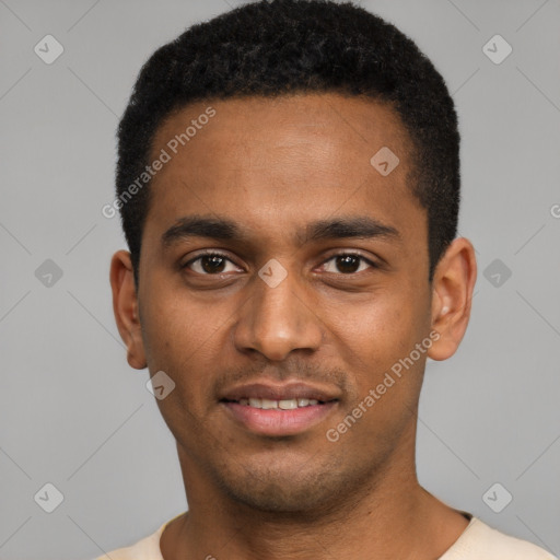 Joyful black young-adult male with short  black hair and brown eyes