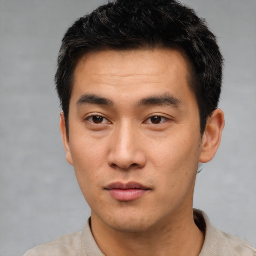 Neutral asian young-adult male with short  black hair and brown eyes