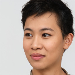 Joyful asian young-adult female with short  black hair and brown eyes