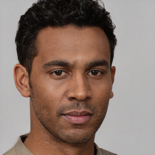 Neutral latino young-adult male with short  brown hair and brown eyes