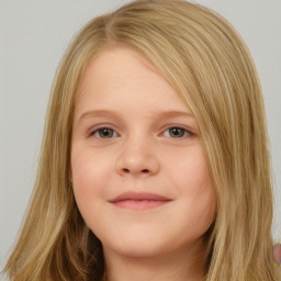 Joyful white child female with long  brown hair and brown eyes