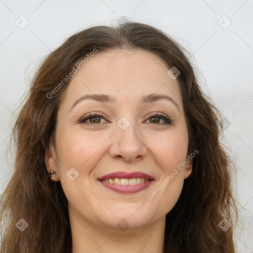 Joyful white adult female with long  brown hair and brown eyes