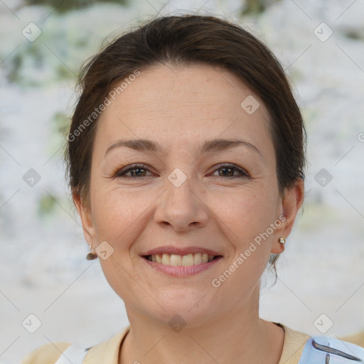 Joyful white adult female with short  brown hair and brown eyes