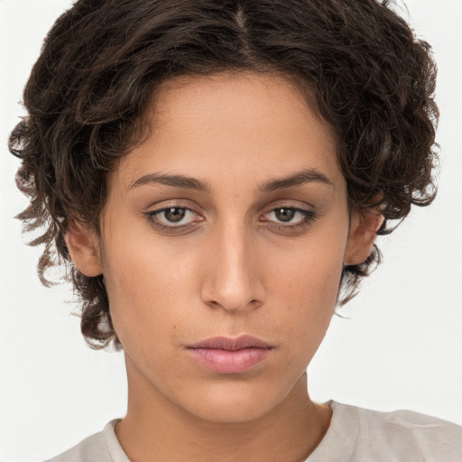 Neutral white young-adult female with short  brown hair and brown eyes