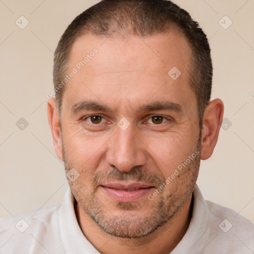 Joyful white adult male with short  brown hair and brown eyes