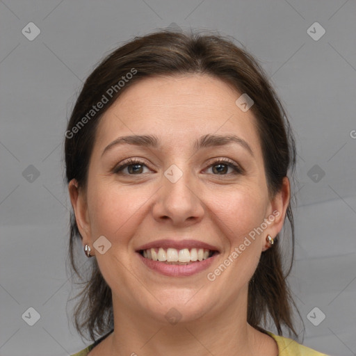 Joyful white young-adult female with medium  brown hair and grey eyes