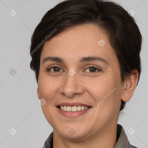 Joyful white adult female with short  brown hair and brown eyes