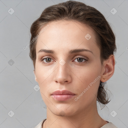 Neutral white young-adult female with medium  brown hair and brown eyes