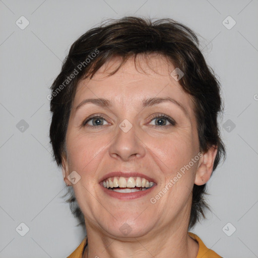 Joyful white adult female with short  brown hair and brown eyes