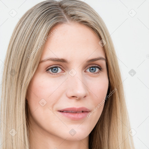 Joyful white young-adult female with long  brown hair and blue eyes