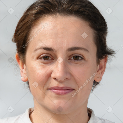 Joyful white adult female with short  brown hair and brown eyes