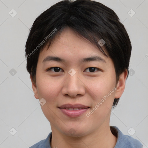 Joyful asian young-adult female with short  brown hair and brown eyes