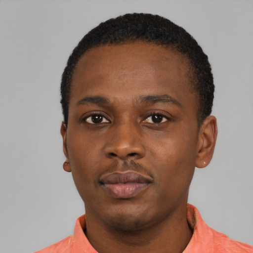 Neutral black young-adult male with short  black hair and brown eyes
