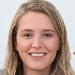 Joyful white young-adult female with long  brown hair and blue eyes