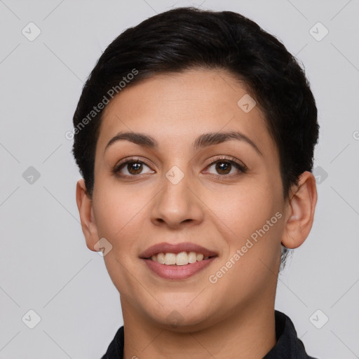 Joyful latino young-adult female with short  brown hair and brown eyes