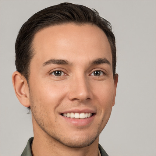 Joyful white young-adult male with short  brown hair and brown eyes