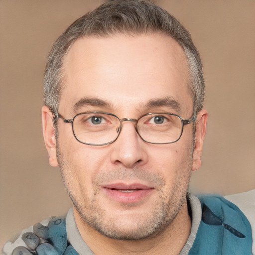 Joyful white adult male with short  brown hair and brown eyes