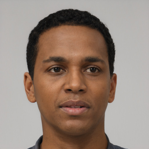 Neutral black young-adult male with short  black hair and brown eyes