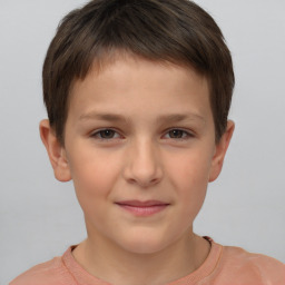 Joyful white child female with short  brown hair and brown eyes