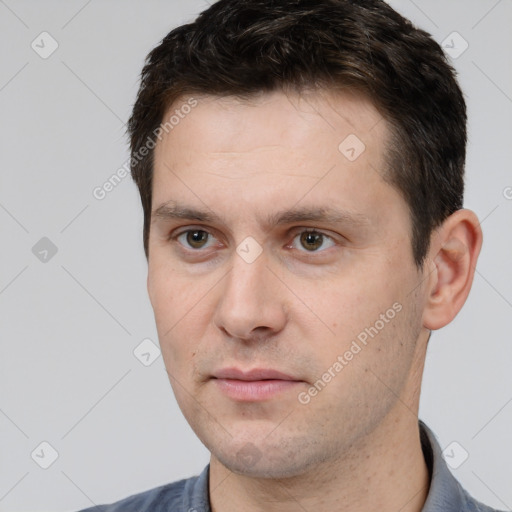 Neutral white young-adult male with short  brown hair and brown eyes