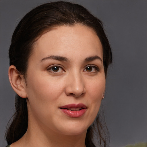 Joyful white young-adult female with medium  brown hair and brown eyes