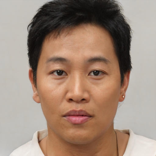 Neutral asian young-adult male with short  brown hair and brown eyes