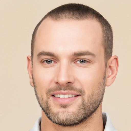 Joyful white young-adult male with short  brown hair and brown eyes