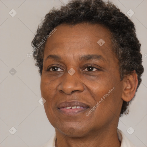 Joyful black adult female with short  brown hair and brown eyes