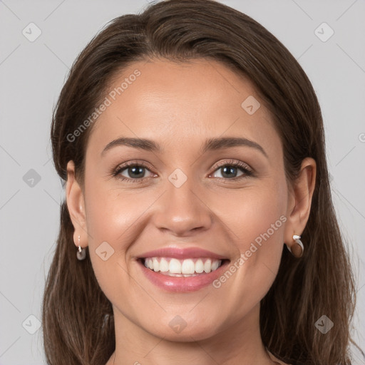 Joyful white young-adult female with long  brown hair and grey eyes