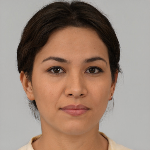 Joyful asian young-adult female with medium  brown hair and brown eyes