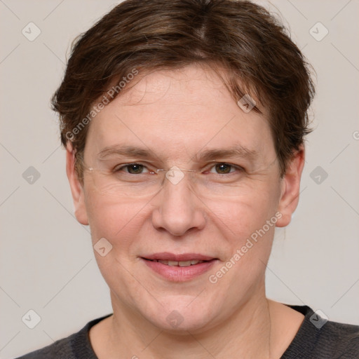 Joyful white adult female with short  brown hair and grey eyes