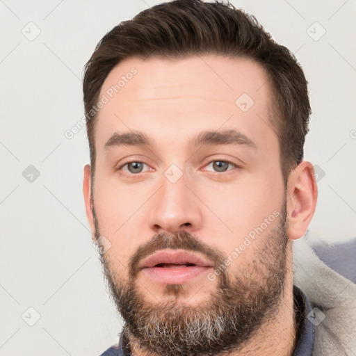 Neutral white young-adult male with short  brown hair and brown eyes