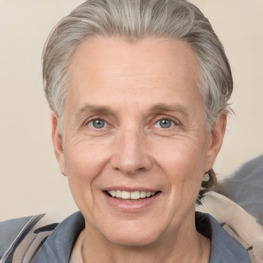 Joyful white middle-aged male with short  gray hair and brown eyes