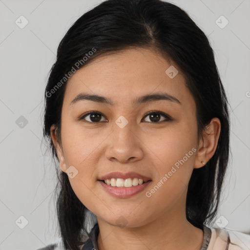 Joyful latino young-adult female with medium  brown hair and brown eyes