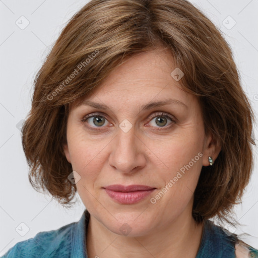 Joyful white adult female with medium  brown hair and green eyes