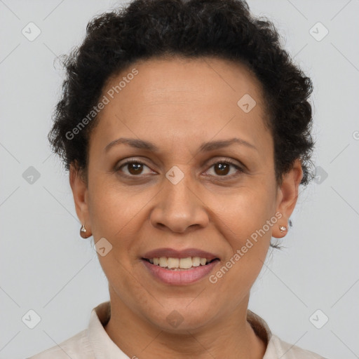 Joyful latino adult female with short  brown hair and brown eyes