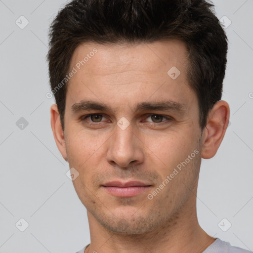 Joyful white young-adult male with short  brown hair and brown eyes