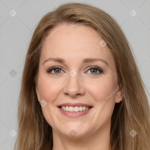 Joyful white adult female with long  brown hair and grey eyes