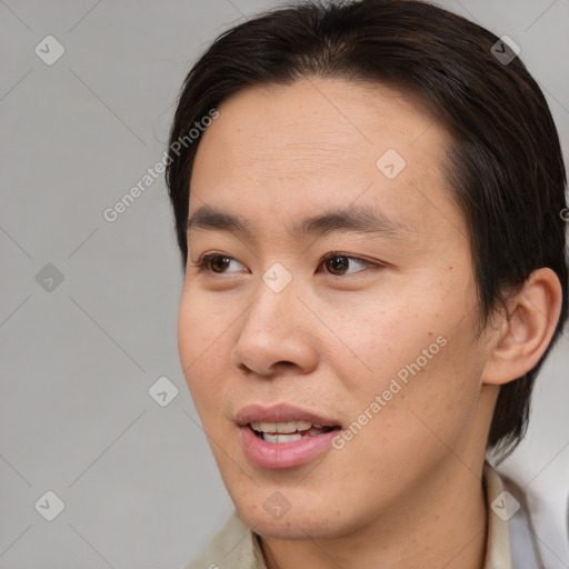 Joyful white young-adult male with medium  brown hair and brown eyes