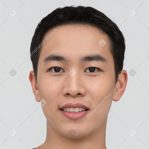 Joyful asian young-adult male with short  black hair and brown eyes