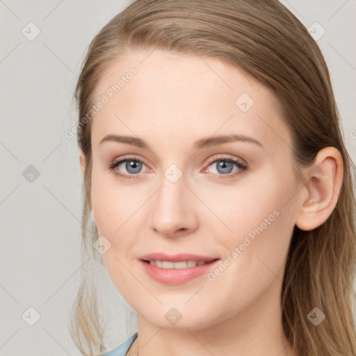 Joyful white young-adult female with long  brown hair and blue eyes