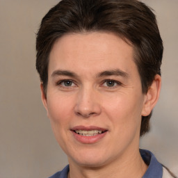 Joyful white adult female with short  brown hair and brown eyes