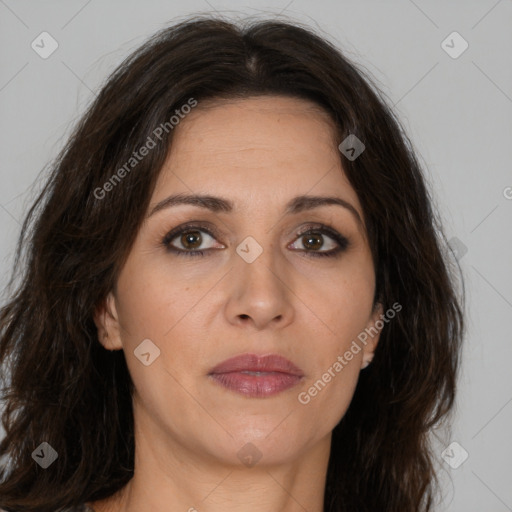 Joyful white adult female with long  brown hair and brown eyes