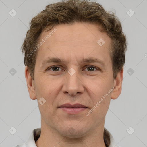 Joyful white adult male with short  brown hair and grey eyes