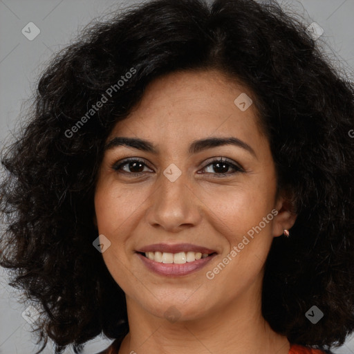 Joyful latino young-adult female with long  brown hair and brown eyes